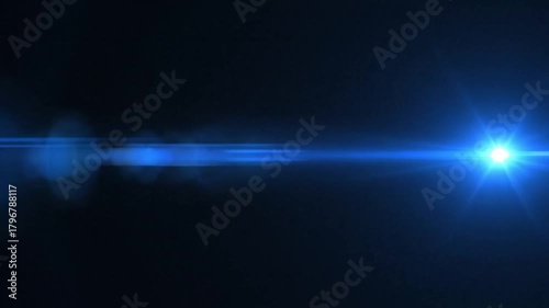 A bright blue lens flare effect stretching horizontally across a dark background with bokeh lights