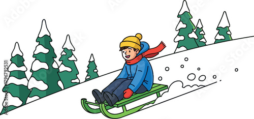 Boy enjoys winter fun sledding down snowy hill with trees on a bright winter day