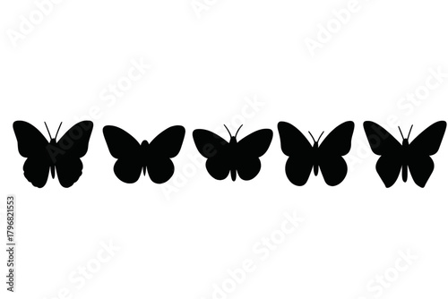 Collection of five butterfly silhouettes in various poses arranged in a line for artistic display
