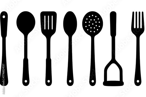 Kitchen utensils lined up in a stylish arrangement showing various tools for cooking and serving food