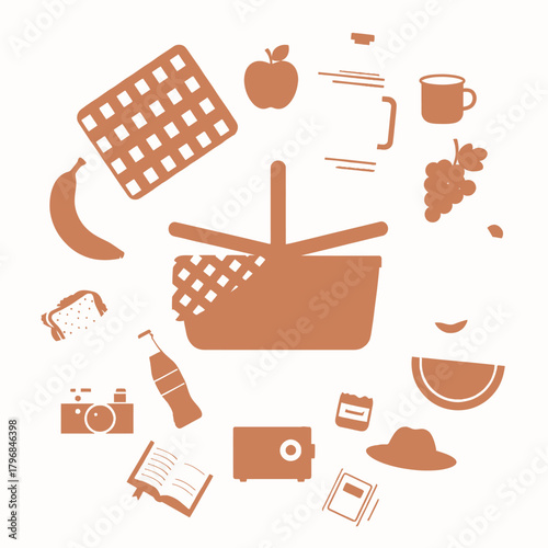 An illustration of picnic items arranged around a basket, featuring food, camera, and accessories