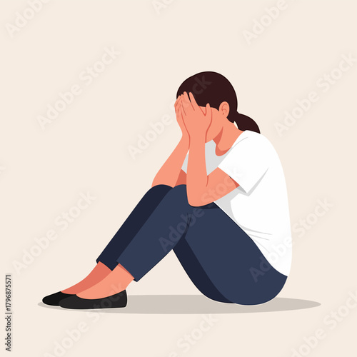 Sad, Depressed Woman Crying and Covering Face While Sitting on the Floor. Mental Health Issues Concept.