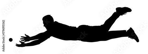Silhouette of a person diving to catch a ball, showcasing dynamic action and movement in a sports or game setting, capturing a moment of athleticism