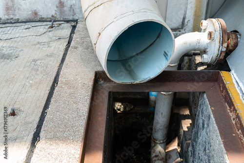 Drain of pipe for draining rainwater from the building into the old gutter below.