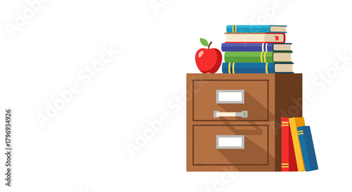 Office supplies with books and red apple on filing cabinet