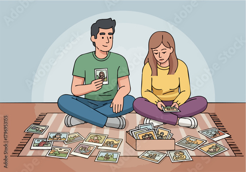 A couple sits on a rug, looking at old photographs together, reminiscing.