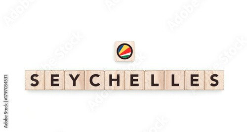 Wooden blocks bearing the name and flag of Seychelles. Seychellois, Indian and African Culture, national identity, travel, and geography in a copy space design.