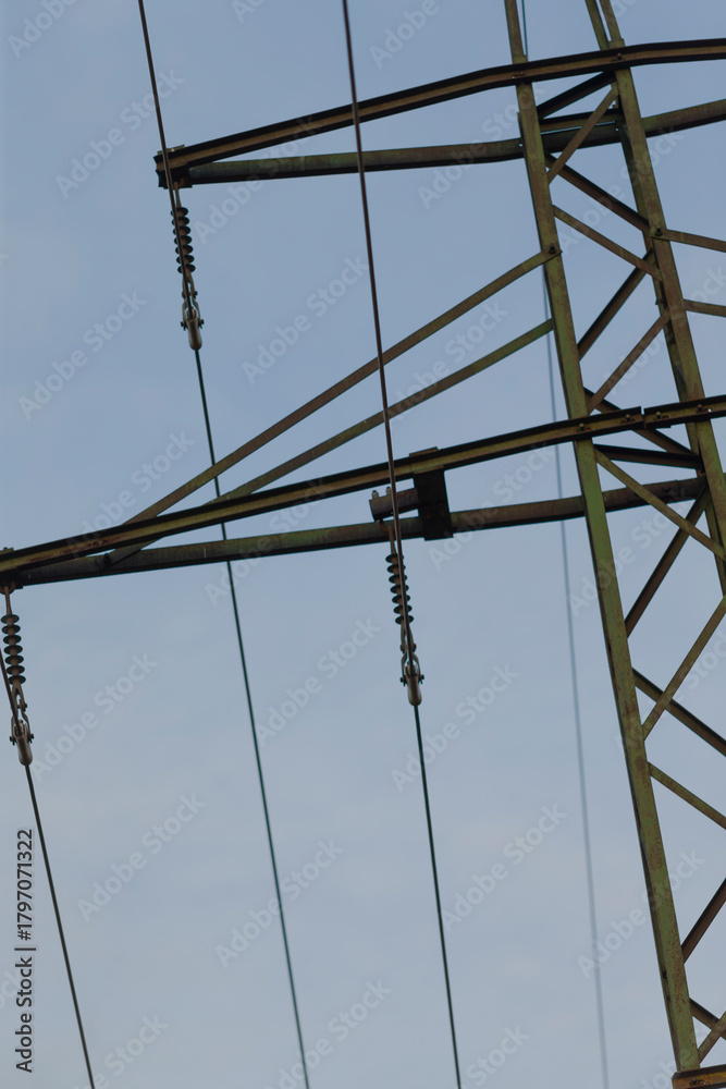 custom made wallpaper toronto digitalDetail of high voltage power lines and tower structure, showcasing electrical infrastructure against a bright blue sky.
