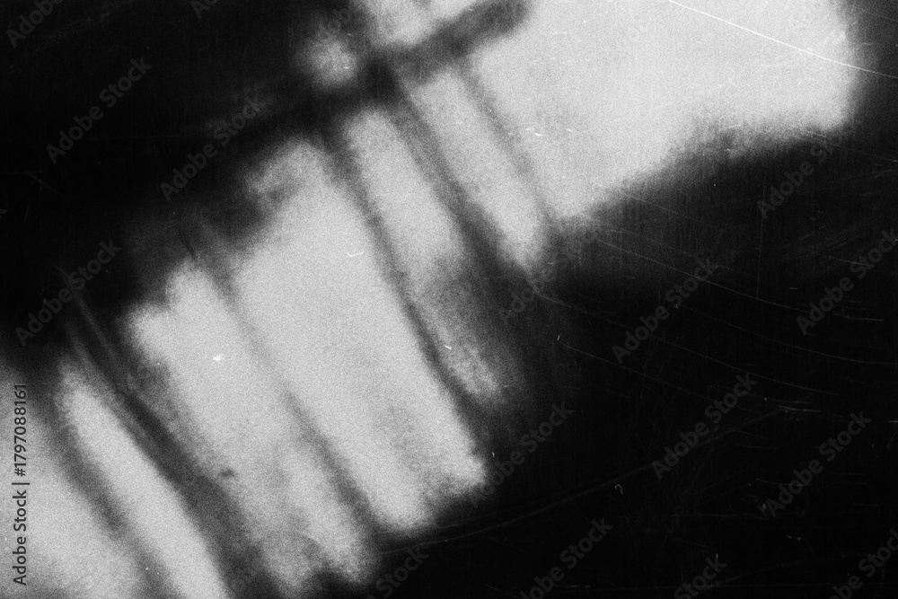 Fototapeta premium Old film texture with scratches, noise and light leaks. Realistic transparent overlay film texture in black-white, dust and grain. Distressed retro movie or photo negative effect of cinema nostalgia