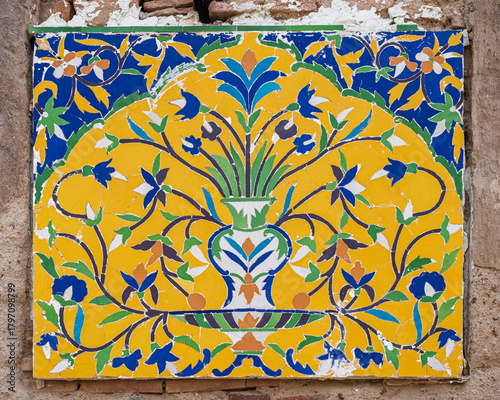 Beautiful kashi-kari or faience tile mosaic panel decor with floral motif on historic Asif Khan mughal tomb, Shahdara Bagh, Lahore, Punjab, Pakistan