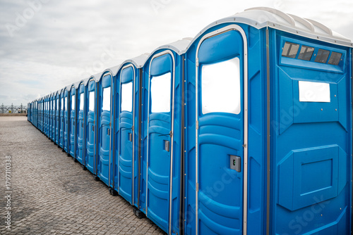 Photos Panoramic view of numerous blue portable public toilets lined up, Lisboa-portugal