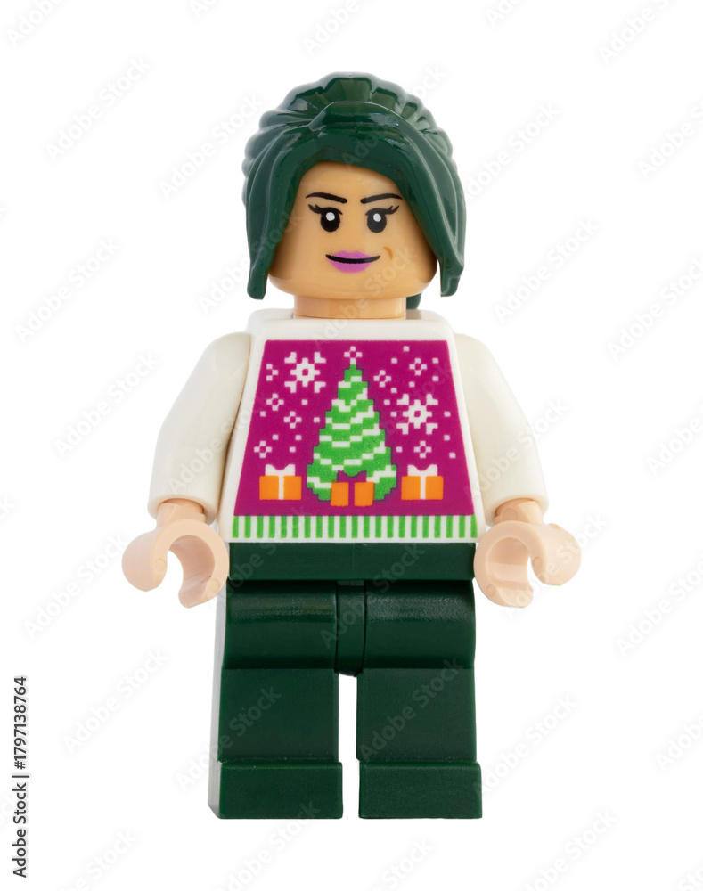 Naklejka premium Dortmund - Deutschland 13. November 2025 - Lego Figur Frau mit Tannebaum Pullover- Studio Aufnahme