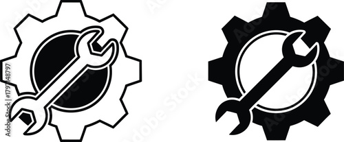 Two gear wheels each displaying a spanner across their center in monochrome design