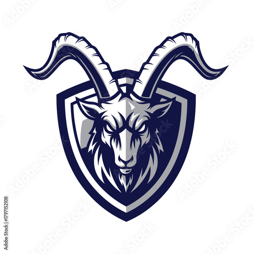 A fierce-faced goat's head within a shield shape, rendered in shades of grey and dark blue