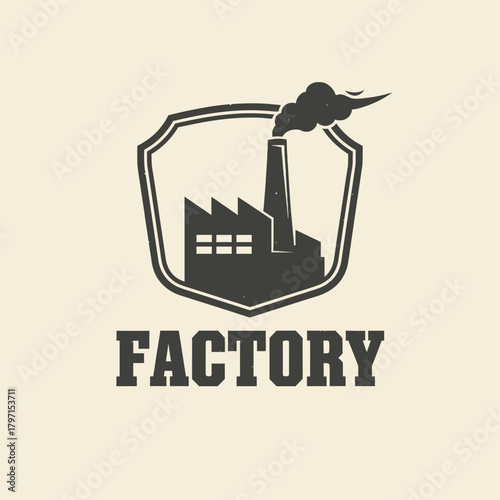 A factory silhouette, encased in a shield, with the word "FACTORY" below. Smoke rises from the chimney