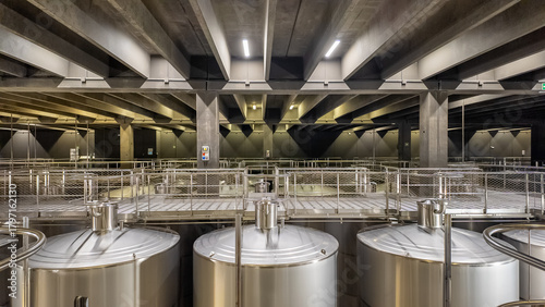 Huge metal fermentation tanks in modern wine factory Rioja Spain