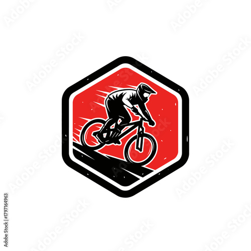 A cyclist in a helmet, riding a bike down a slope within a red-filled hexagon