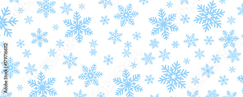 pattern of blue snowflakes scattered across a white background
