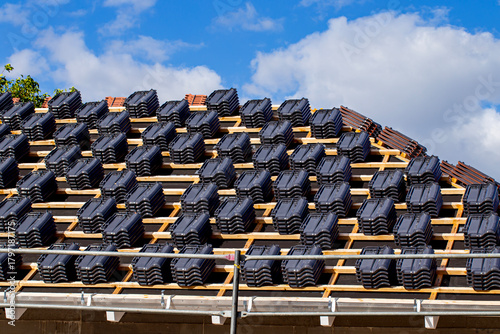 Building house and ceramic tiles over the roof.