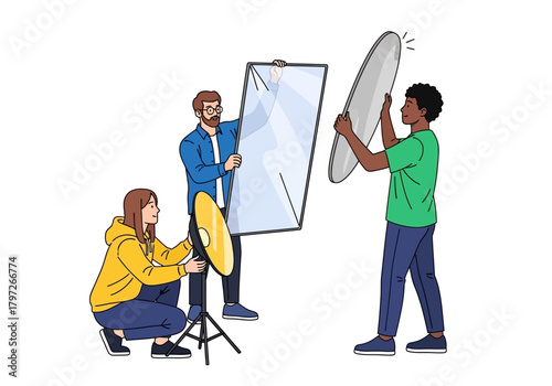 Photography Team Setting Up Lighting Equipment for a Photoshoot Session