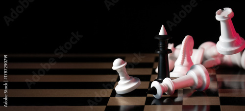Winner. A black king surrounded by white chess pieces in a chess board game competition. Check and mate. Chess match. Bright red light. Acid colors. The concept of a successful team work leader. 