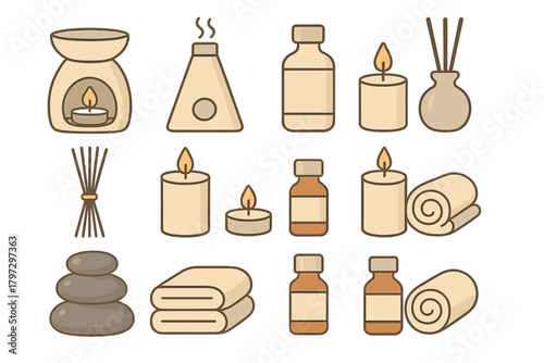 Essential oil bottles, burning candles, diffusers, rolled towels, and stacked massage stones