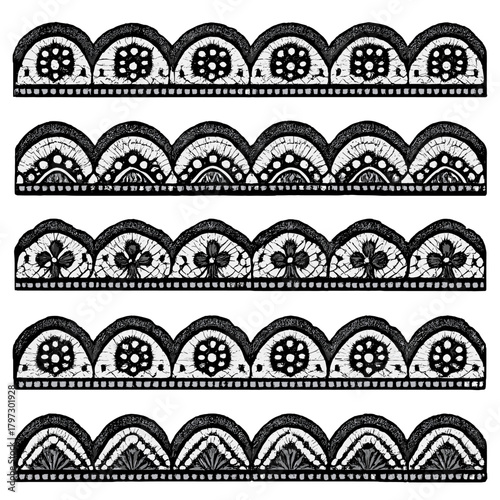 Intricate black and white scalloped borders with floral and ornamental lace patterns