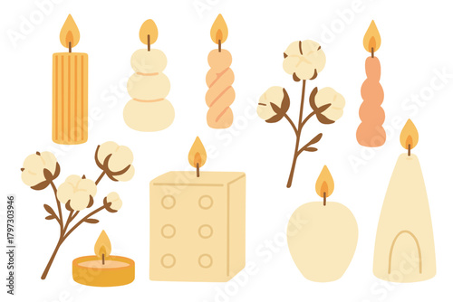 Collection of burning wax candles in various shapes with natural cotton branches