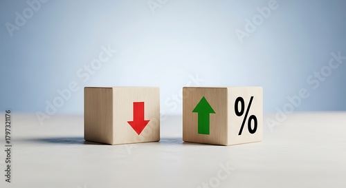 Two wooden cubes with red down arrow and green up arrow with percentage symbol on a light blue background