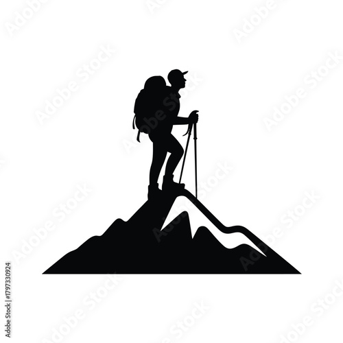 Hiker silhouette on mountain peak with trekking poles summit