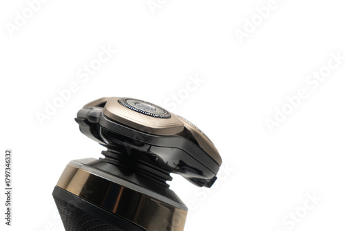 Foto Side view of electric rotary shaver head angled upward against a white background