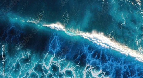 Fototapeta Naklejka Na Ścianę i Meble -  Aerial view of ocean wave with white foam cresting in turquoise water