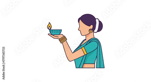 Woman in Traditional Indian Attire Holding a Lit Diya Lamp.