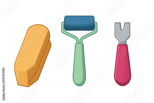 Essential creative tools including eraser, paint roller, and scraper isolated on white