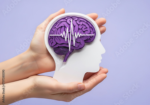 Hands hold brain cutout. Paper head with encephalography on purple background. Alzheimer, autism awareness, stroke, epilepsy, ADHD, seizure disorder, Mental and Neurological Health