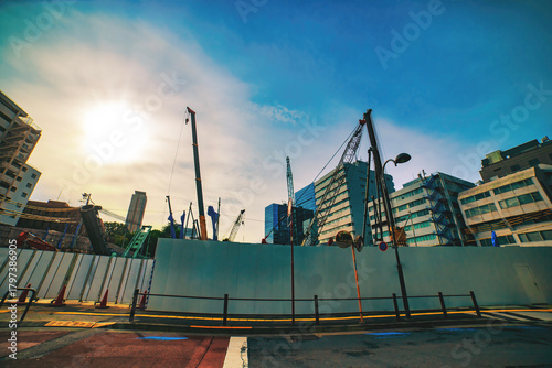 A cityscape of moving crane at the under construction in Tokyo wide shot