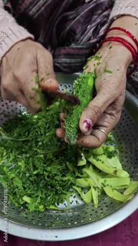 hands holding green asparagus