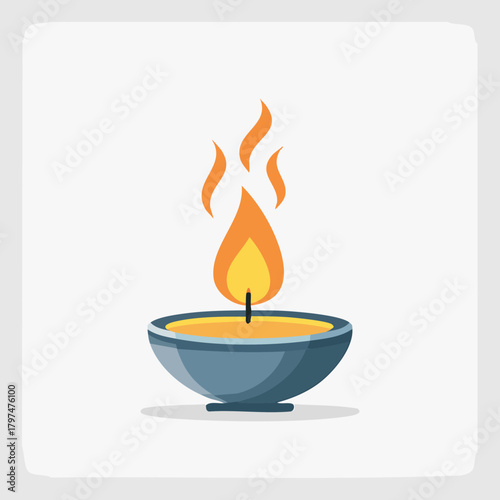 A single lit candle in a blue bowl, casting a warm glow.