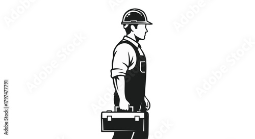 A skilled male worker, dressed in protective overalls and a hard hat, stands confidently holding a classic toolbox, ready for professional service or construction work.