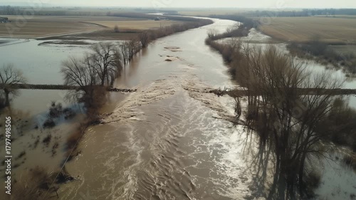 Aerial view of flooded river overflowing its banks