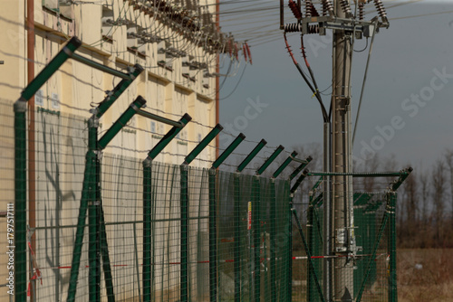 highvoltage reinforced metal fencing, industrial highvoltage electric fencing system details, robust highvoltage electrical fencing infrastructure equipped with safety mechanisms and power support