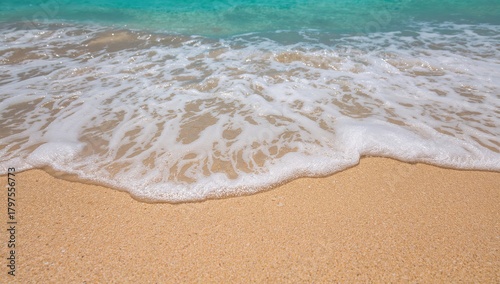 Fototapeta Naklejka Na Ścianę i Meble -  Tropical beach scene with coral sand and sea waves, ideal for relaxation and leisure