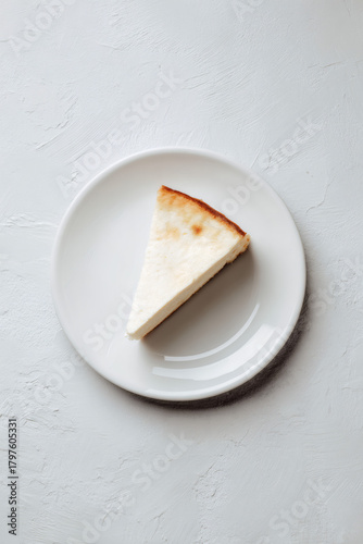 A slice of delicious spanish cheescake on plate, AI generated