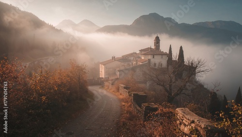 Fototapeta Naklejka Na Ścianę i Meble -  Sea fog envelops an autumn landscape with mountains and a village, highlighting seasonal change