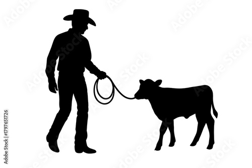 Black silhouette of a cowboy leading a young calf with a lasso rope on a ranch