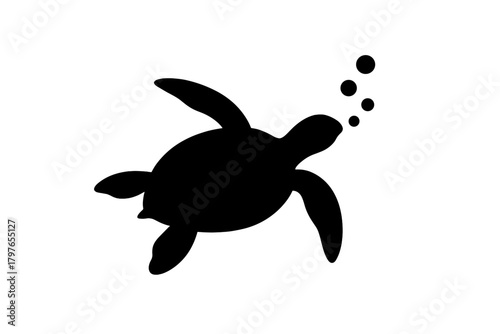 Black silhouette of a swimming sea turtle blowing bubbles in the ocean