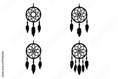 Set of four traditional Native American dreamcatcher silhouettes with feathers and beads in black and white