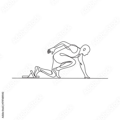 Athlete in starting position ready to sprint