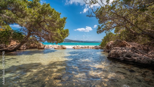 Fototapeta Naklejka Na Ścianę i Meble -  Sardinia's serene creek with clear waters, natural erosion risk