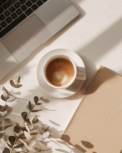 Workspace flatlay, laptop, coffee cup, notebook, soft shadows, minimalist aesthetic, lifestyle stock image look